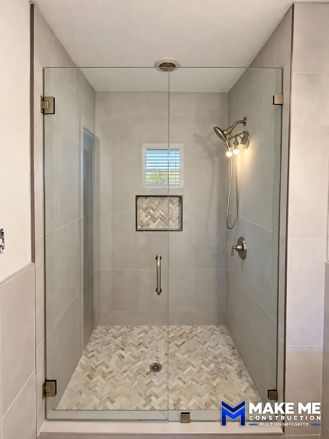 Frameless Shower with Herringbone Tile